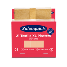 A red-white box labeled "Orkla Wound Care AB Xl textile plaster, 21 pieces/mine | Package (6 pieces)" with two beige textile plasters in sizes 80 x 30 mm and 80 x 60 mm, along with product and certification details.