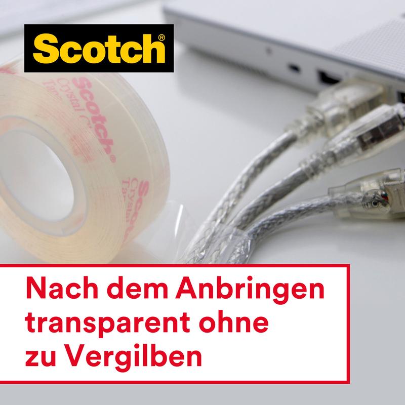 Next to plugged-in computer cables is a roll of Scotch® Crystal Tape, transparent (19 mm x 33 m) by 3M Deutschland GmbH; once applied, it remains permanently clear without yellowing - ideal for office supplies.
