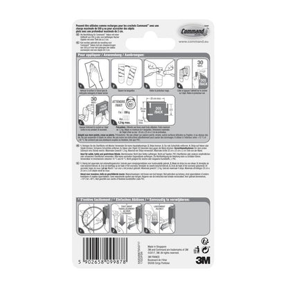 On the back of a package of 3M Deutschland GmbH Kleine Command™ Strips S, 17022N, there are illustrated, multilingual instructions for applying and removing adhesive strips without nails to keep walls damage-free, as well as a barcode at the bottom edge.