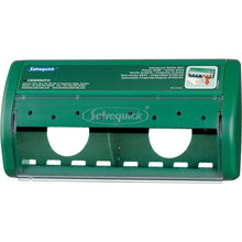 A green Orkla Wound Care AB Salvequick plaster dispenser, empty | Pack (1 piece), features two round openings, a transparent lid, printed instructions on the top right, and visible branding on the front.