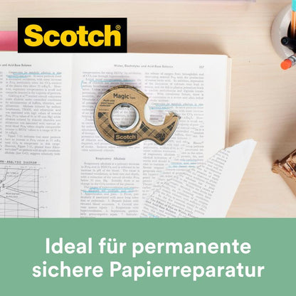 A roll of Scotch® Magic™ Tape (19 mm x 20 m) made from 66% plant-based adhesive with a dispenser made from recycled material lies on a marked textbook. Ideal for permanent, secure paper repair. Brand: 3M Deutschland GmbH.