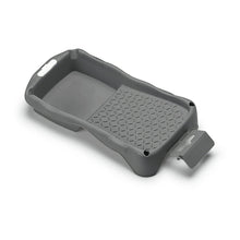 The Nölle Profi Brush Mini Paint Tray (12 x 22 cm) from Nölle Profi Brush Bürsten- & Pinseltechnik e.K. is a gray paint tray made of regranulate with raised edges, a textured surface, molded handles, and a removable spout.