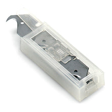 A close-up of the Nölle Profi Brush Dispenser with 10 replacement blades, hook shape from Nölle Profi Brush Bürsten- & Pinseltechnik e.K., where one of the replacement blades is visible in the transparent plastic container.