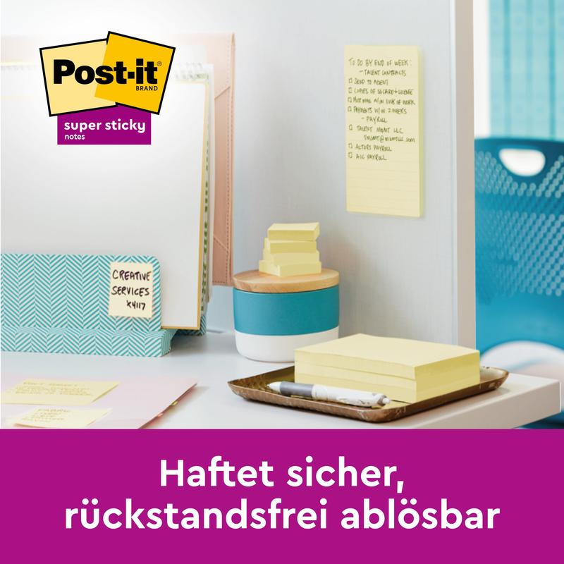 A tidy desk with the Post-it® Super Sticky Notes (47.6 x 47.6 mm, 90 sheets/block, 100% PEFC) from 3M Deutschland GmbH and a yellow note on the wall with the inscription: "Sticks securely, removable without residue."