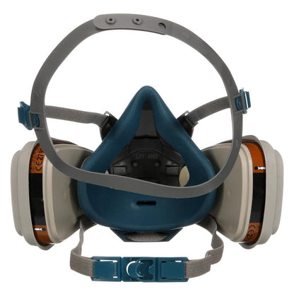 The 3M™ Quick Latch Respirator 6502QLKIT-1 from 3M Deutschland GmbH offers reusable protection against organic vapors with replaceable A2P3 filters, dual cartridges, adjustable straps, and a blue-gray design - see front view.