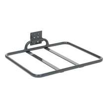 The TASKI foldable bag shelf from Diversey Deutschland GmbH & Co. OHG is a gray, smooth metal shelf with a rectangular frame, two middle bars, and a bracket for mounting on the front or back of the trolley. Foldable for easy storage. Package: 1 piece.