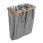 The TASKI small laundry bag (26 l) from Diversey Deutschland GmbH & Co. OHG is a gray fabric container with two compartments, orange border, and black drawstrings, ideal for sorting items or as a cleaning kit bag. Requires cloth box holder 7517270 or 7517371.