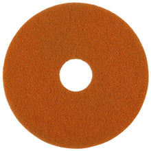 The Twister Pad orange for stone floors by Diversey Deutschland GmbH & Co. OHG is a round, flat pad with a rough texture and microscopic diamonds, hole in the middle, depicted on a white background.
