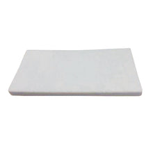 The TASKI WipeOut hand pad from Diversey Deutschland GmbH & Co. OHG is a rectangular, white melamine pad for basic cleaning and removal of stubborn dirt, available in a pack of 5.