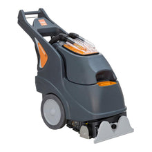 The TASKI procarpet 30 spray extraction and encapsulation machine from Diversey Deutschland GmbH & Co. OHG has a gray-orange body, a large handle, two wheels, a transparent upper compartment, and a wide cleaning head on a white base.