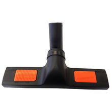 The 300mm floor nozzle from Diversey Deutschland GmbH & Co. OHG for TASKI Steamer with 300mm working width, shown at the front with two orange pads, is suitable for professional cleaning; Delivery: 1 piece.