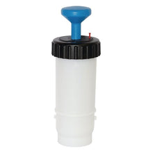 The TASKI VersaPlus 2.0 bottle 0.6 L blue from Diversey is a 600 ml pressure bottle made of white plastic with a black screw cap, blue T-handle, and red indicator, designed for the TASKI VersaPlus 2.0 cleaning system (1 piece).