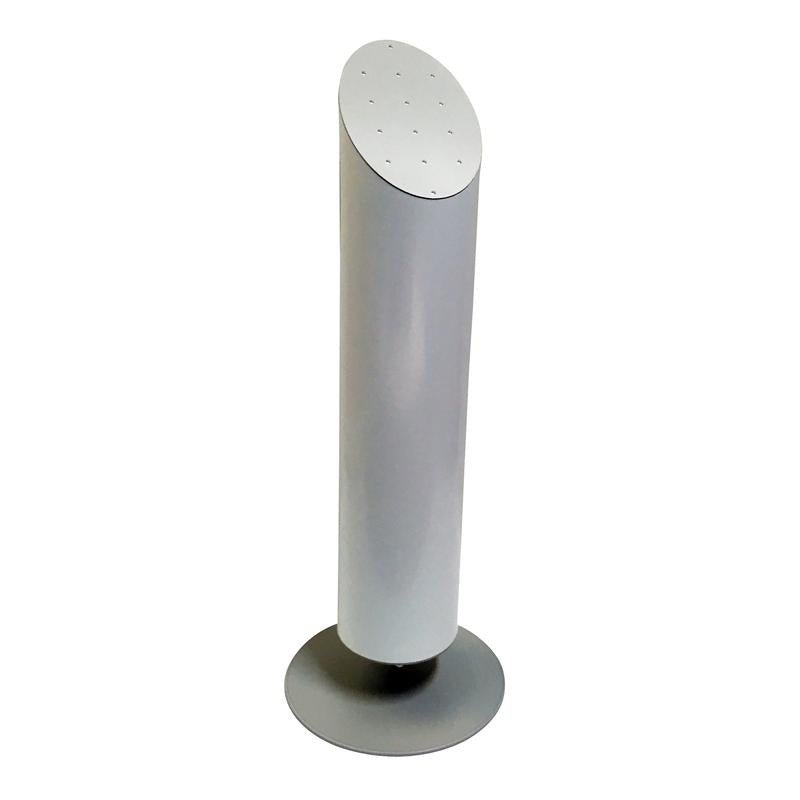 The Nomad Aroma Diffuser Good Sense air freshener column from Diversey Deutschland GmbH & Co. OHG is a tall, silver, cylindrical air freshener with a flat top and small holes, standing upright on a round base against a white background.