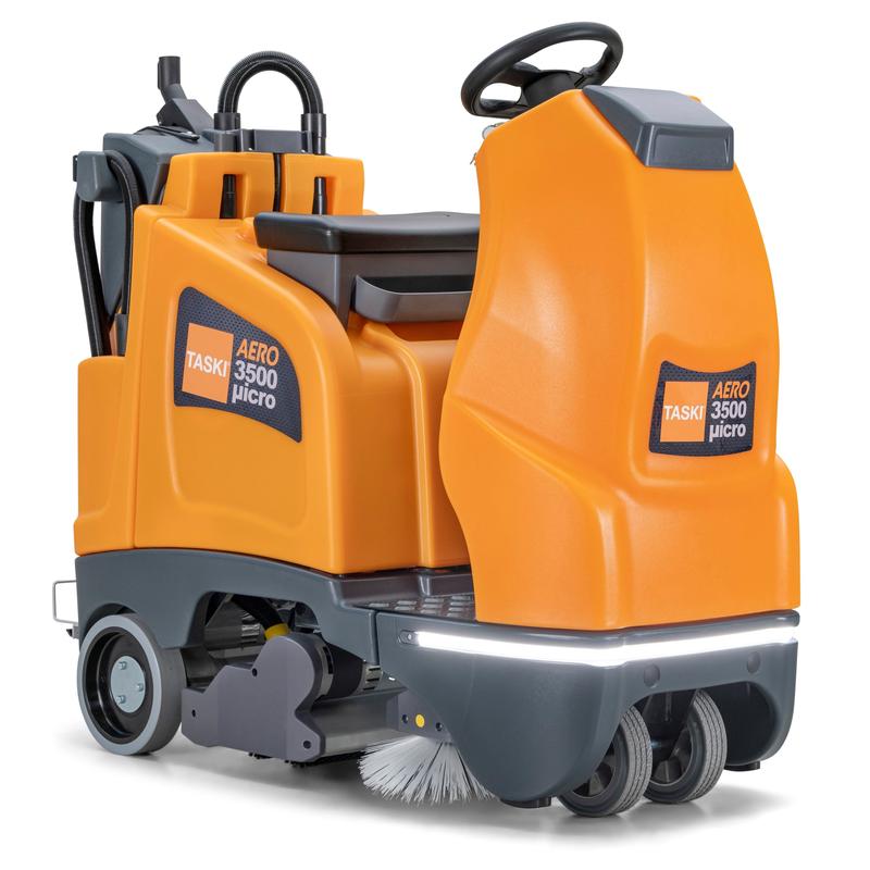 The TASKI AERO 3500µicro B from Diversey Deutschland GmbH & Co. OHG is a compact battery-operated micro ride-on sweeper with wheel drive, seat, steering wheel, cleaning brushes, and storage compartments. Batteries included (without external charger).