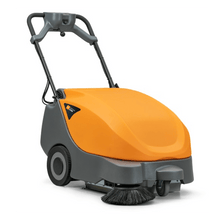 The TASKI balimat 2300 RTU from Diversey Deutschland GmbH is a hand-guided sweeper vacuum for daily sweeping of medium areas, including 2 roller brushes, side broom, 42.5Ah battery, and charger.