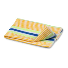 A folded towel with yellow, green, and blue stripes on a white background, ideal for gentle cleaning like the Nölle Profi Brush cotton dust cloth from Nölle Profi Brush Bürsten- & Pinseltechnik e.K.
