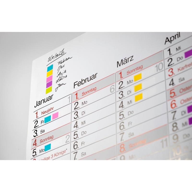 A German wall calendar for January-March shows various appointments color-coded with a key, handwritten notes, and the Post-it® Index Flags Mini and Index Arrows from 3M Deutschland GmbH in blue and yellow in the upper left corner.