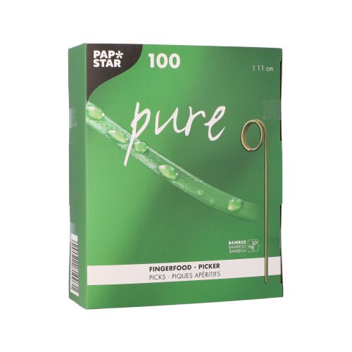 A green box from PAPSTAR GmbH with the inscription "pure" contains 100 finger food picks (11 cm) – perfect for parties. The packaging features a bamboo skewer and a close-up of a green, dewy stem.