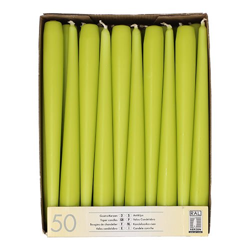 A box with 50 Starpak taper candles, each with a diameter of 2.2 cm and a length of 25 cm, arranged upright in a single layer. The label on the front contains product information and the Starpak brand with a certification logo.