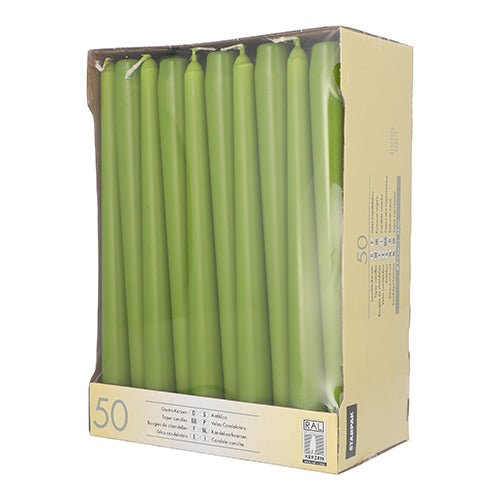 The Starpak 50 taper candles Ø 2.2 cm - 25 cm are green taper candles, arranged upright and visible through a clear window on the beige box. These Starpak candles offer a long burn time for a sustainable ambiance.