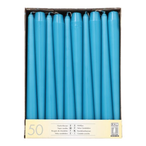 A box with 50 Starpak taper candles (Ø 2.2 cm - 25 cm) in two rows, with long burning time and a beige label with quantity and multilingual product information at the bottom.