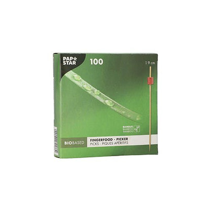 The green box "PAPSTAR 100 Fingerfood - Picker" by PAPSTAR GmbH contains 100 bamboo picks each 9 cm long. The bio-based packaging shows a pick with a red tip, ideal for serving finger food skewers at any event.