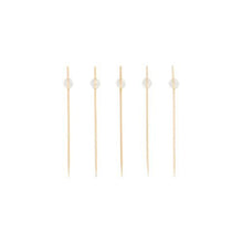 Five PAPSTAR 100 finger food - picks from PAPSTAR GmbH, each with a small clear pearl at the top end, are arranged in a straight, horizontal line on a plain white background.