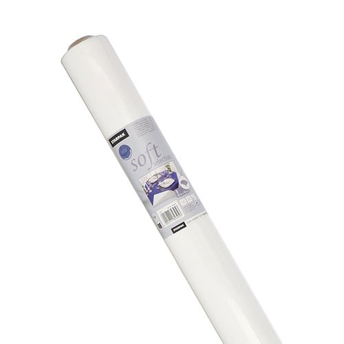 On a white background, a diagonally placed roll of Starpak tablecloth, fabric-like, fleece 'Soft Selection' is depicted, with a label showing product details, the brand name Starpak, and the image of a made bed.