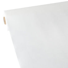 A roll of Starpak tablecloth—fabric-like, “soft selection” nonwoven fabric in white—is unrolled on a flat surface so that the smooth, lightweight fabric and the partially visible cardboard tube are visible on the left.