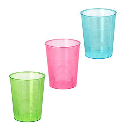 Three color-sorted Starpak shot glasses made of PS (4 cl, Ø 4.2 cm · 5.2 cm) in green, pink, and blue are displayed with recycling symbols and fine embossing on a white background. The package contains 40 pieces in shrink wrap.