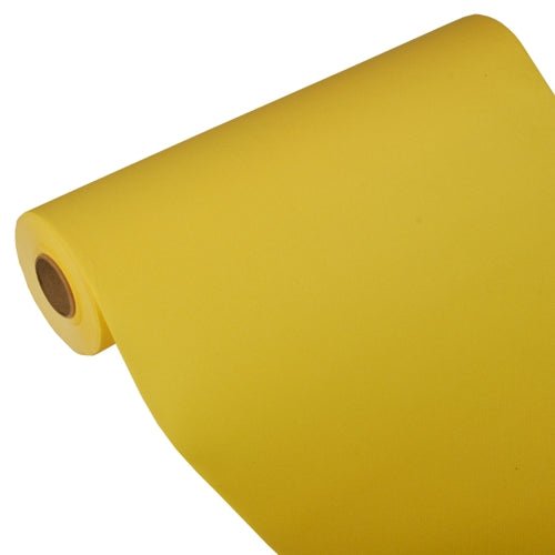 A large roll of yellow PAPSTAR table runner, Tissue "ROYAL Collection" 24 m x 40 cm from PAPSTAR GmbH is unwound at an angle, so that the core is visible at one end against a plain white background.