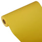 A large roll of yellow PAPSTAR table runner, Tissue "ROYAL Collection" 24 m x 40 cm from PAPSTAR GmbH is unwound at an angle, so that the core is visible at one end against a plain white background.