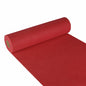 A roll of Starpak table runner, fabric-like fleece "Soft Selection" (24 m x 40 cm), is partially unrolled on a white surface, the roll is on the left and the red runner extends to the lower right corner.
