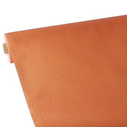 A partially unrolled Starpak tablecloth, fabric-like, fleece "soft selection plus" in plain orange is displayed against a white background, with the fabric-like texture subtly visible.