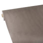 A roll of Starpak tablecloth, fabric-like, fleece "soft selection plus" in light brown is partially unrolled on a white surface, with the durable core of this Starpak tablecloth visible on the left.
