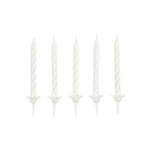 Five unlit white PAPSTAR birthday candles 6 cm with holder (PAPSTAR GmbH, blister pack of 24 pieces) are arranged in a straight horizontal line on a solid white background.