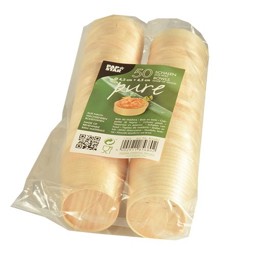 Two stacks of PAPSTAR 50 finger food bowls, wood "pure" round, are eco-friendly packed in clear foil. The label provides product information and confirms the content of 50 bowls of the PAPSTAR GmbH brand.