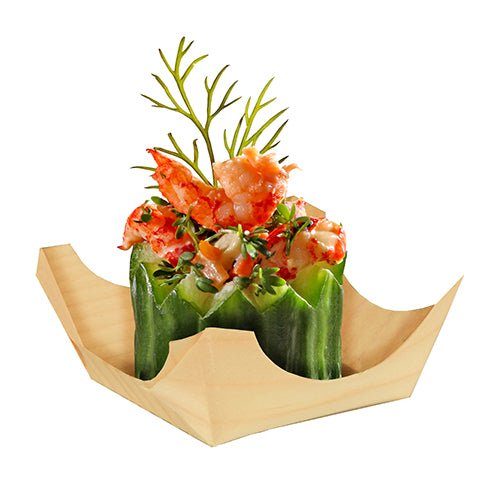 A PAPSTAR 50 finger food bowl, wood "pure" round from PAPSTAR GmbH holds a cucumber bowl with chopped lobster, garnished with dill and herbs. Its elegant appearance forms a nice contrast to the simple white background.
