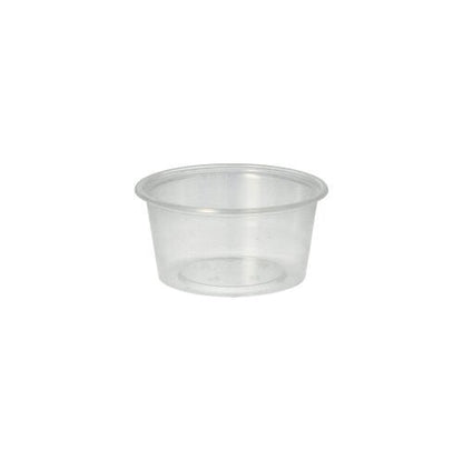 The Starpak 50 dressing cup, PP round Ø 7.1 cm transparent by Starpak features smooth sides and a slightly rolled rim, ideal for catering service, depicted against a plain white background.