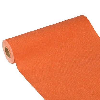 The Starpak table runner 'Soft Selection Plus' made of fabric-like fleece (24 m x 40 cm) is partially unrolled, showing structure and cylindrical shape - ideal as a stylish table runner for special occasions.