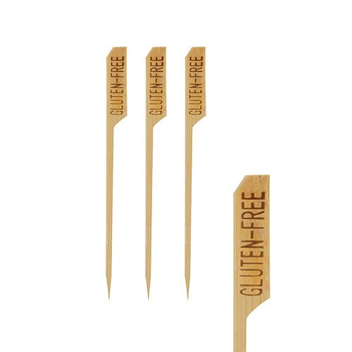 Four PAPSTAR 250 finger food skewers "pure" by PAPSTAR GmbH with pointed ends are depicted on a white background. On each wooden pick, perfect for party buffets, "GLUTEN-FREE" is engraved at the top.