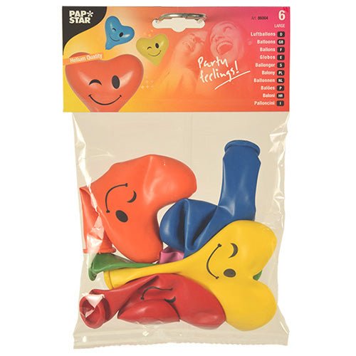 A 6-pack of PAPSTAR balloons "Heart - Blinky", Ø 28 cm, assorted colors, from PAPSTAR GmbH. Each heart-shaped balloon is printed with a smiley. The packaging shows inflated balloons and the slogan "Party feelings!".