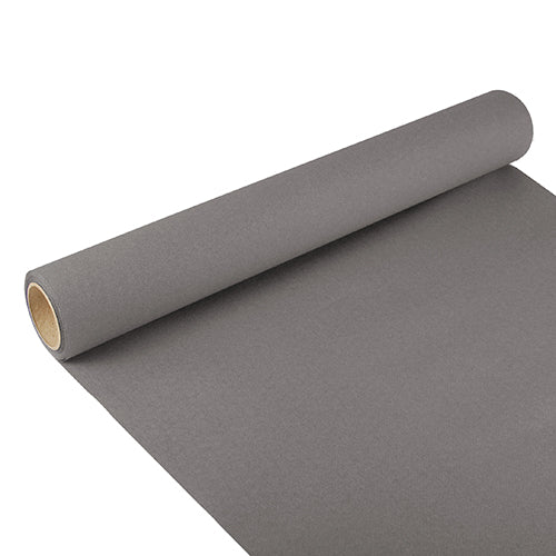 A partially unrolled table runner from PAPSTAR GmbH, Tissue “ROYAL Collection” (3 m x 40 cm), with elegant design, lies on a white surface and reveals the brown cardboard tube in its center.