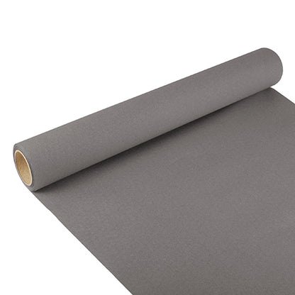 A partially unrolled table runner from PAPSTAR GmbH, Tissue “ROYAL Collection” (3 m x 40 cm), with elegant design, lies on a white surface and reveals the brown cardboard tube in its center.