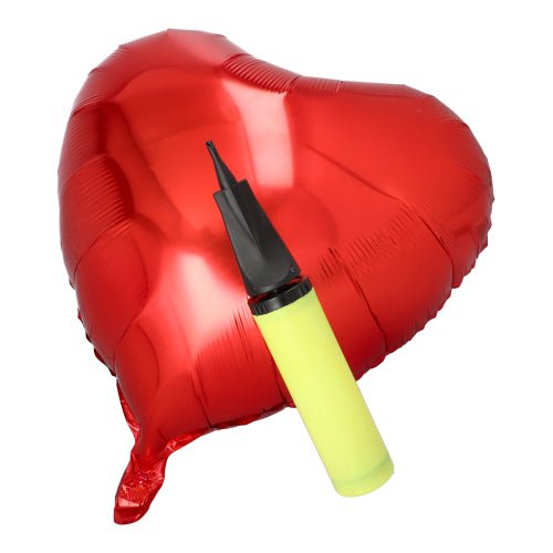 A red heart-shaped foil balloon is crowned with the PAPSTAR pump for foil balloons, yellow, 28x4.5 cm (1 piece) from PAPSTAR GmbH - an ideal piece of stylish party accessory on a white background.