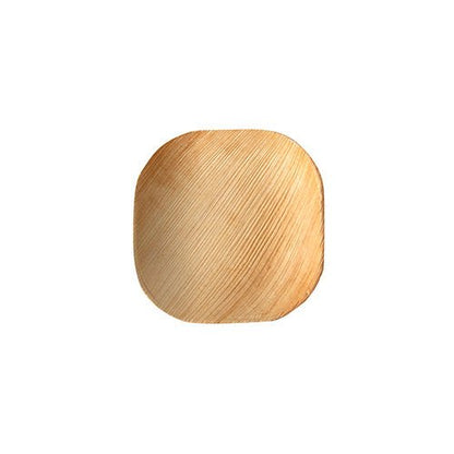 The PAPSTAR 25 plates palm leaf "pure" of PAPSTAR GmbH is a small, square plate with rounded edges made of light palm leaf. Its eco-friendly design impresses with its unique natural grain and is depicted on a plain white background.