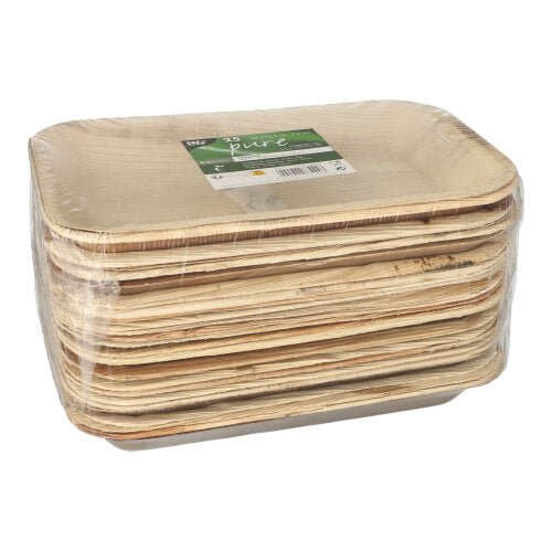 A stack of PAPSTAR 25 tablets, palm leaf "pure" square by PAPSTAR GmbH, packaged in clear foil with a green-white label; these rectangular plates are biodegradable.
