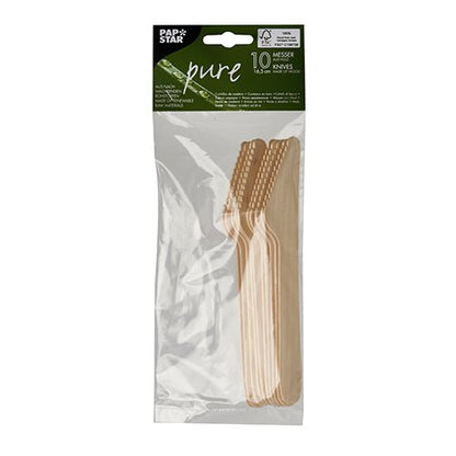 Ten PAPSTAR 10 knives, wood "pure" knives from PAPSTAR GmbH are neatly stacked in a transparent plastic packaging and labeled with a green-white sticker containing brand and product information. The knives are made of biodegradable wood.