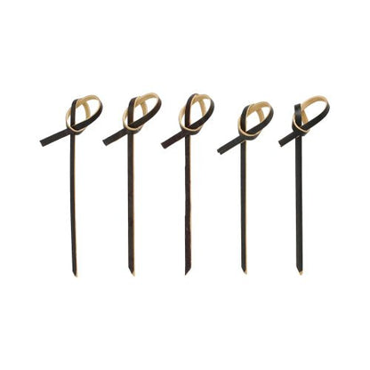 Five PAPSTAR 250 finger food picks from PAPSTAR GmbH in black with light brown bow accents at the top, arranged in a row on a white background.