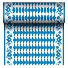 The PAPSTAR Airlaid table runner "Bayrisch Blau" (24 m x 40 cm) from PAPSTAR GmbH is a fabric-like table runner with a blue and white diamond center and a blue floral border. The roll reveals its repeating Bavarian pattern as it unrolls.